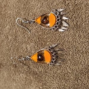 Silver earrings with browns in it.